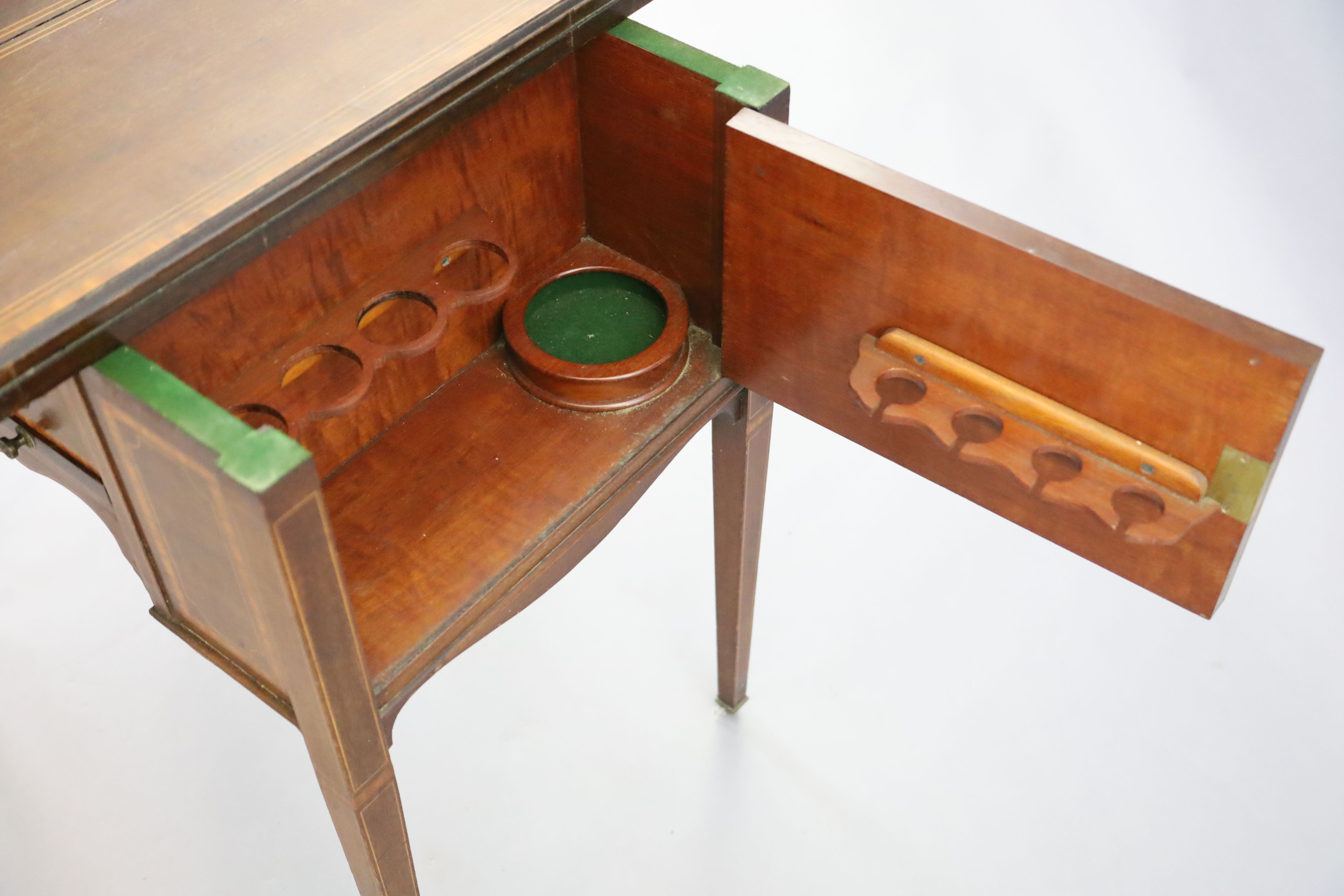 An Edwardian satinwood banded mahogany games/drinks table,